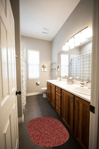 Super Area Rugs Rustic Farmhouse Living Indoor/Outdoor Reversible Braided Rug - Made in USA - Red Mix 2' X 3' Oval in Wooden and Grey Bathroom