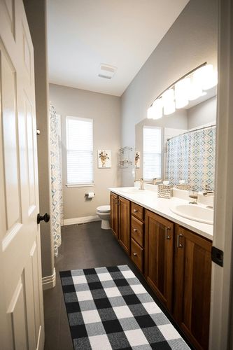 KIMODE Buffalo Plaid Outdoor Rug Runner Doormat 24'' x 51", Black/White Cotton Woven Checkered Farmhouse Porch Outdoor Rugs, Washable Indoor Door Mat for Front Layered Kitchen Bathroom Laundry Room in Wooden and Grey Bathroom