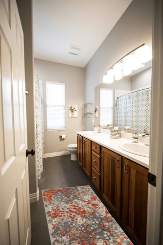 SAFAVIEH Monaco Collection Accent Rug - 2'2" x 4', Grey & Orange, Boho Abstract Watercolor Design, Non-Shedding & Easy Care, Ideal for High Traffic Areas in Entryway, Living Room, Bedroom (MNC225H) in Wooden and Grey Bathroom