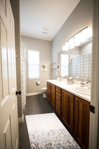 Loloi II Maddox Collection MAD-04 Sand/Taupe 2'-3" x 3'-9" Accent Rug in Wooden and Grey Bathroom