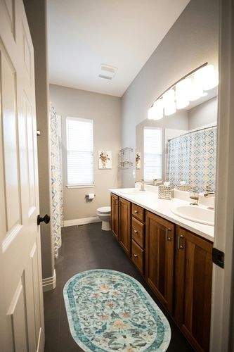 Rifle Paper Co. x Loloi Courtyard Collection COU-03 Sage 2'-3" x 3'-9" Oval Accent Rug feat. CloudPile in Wooden and Grey Bathroom