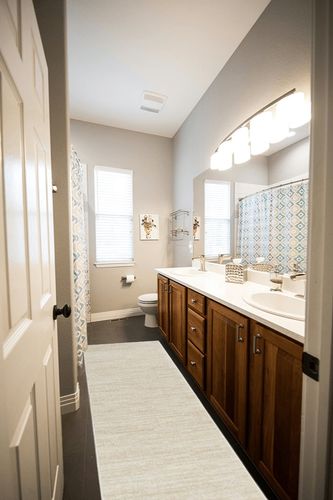 Nourison Essentials Solid Contemporary Ivory Beige, Runner Rug, 2'2" x 7'6" in Wooden and Grey Bathroom