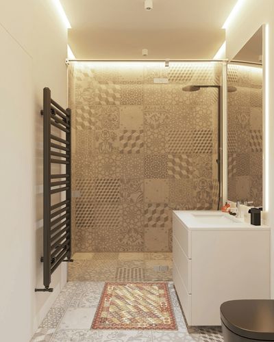 Dash and Albert Alford Handwoven Wool Rug, 2 X 3 Feet, Yellow/Orange/Red Geometric Pattern in White Tiled Bathroom