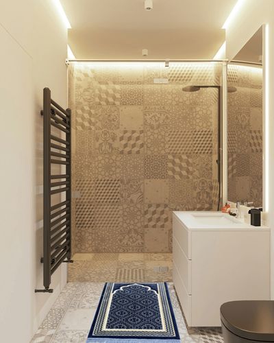 Modefa Turkish Islamic Prayer Rug - Soft Velvet Janamaz Praying Carpet - Comfortable Muslim Praying Mat for Men & Women - Ramadan or Eid Gift - with Kufi Prayer Cap - Elegant Swirl (Blue) in White Tiled Bathroom