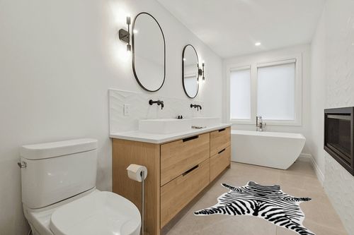 nuLOOM Jayla Machine Washable Zebra Faux Cowhide Accent Rug, 3' 10" x 5', Black and White in Scandinavian Neutral bathroom