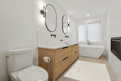 Ayjah Cream Modern Geometric Area Rug Wade Logan Rug Size: Rectangle 4'4" x 6' in Scandinavian Neutral bathroom