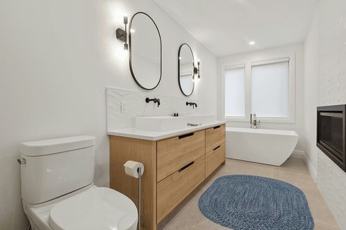 Capel Rugs Claire Oval Braided Area Rug Made in USA Indoor/Outdoor Farmhouse Rug 4' x 6' Blue Jay in Scandinavian Neutral bathroom