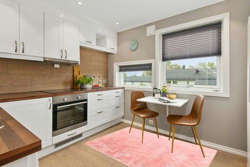 GHOUSE Light Pink 4 ft. x 6 ft. Silky Faux Fur Sheepskin Shag Fluffy Fuzzy Area Rug in Wood and White Small Kitchen