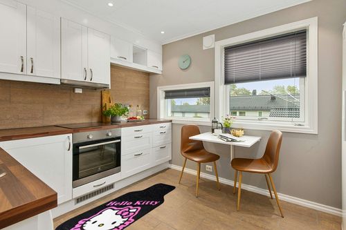 Plasticolor 001502R01 Sanrio Hello Kitty Collage Universal Fit Car Truck SUV Front Floor Mats Pair in Wood and White Small Kitchen