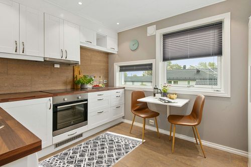 nuLOOM Ansley Moroccan Lattice Tassel Area Rug in Wood and White Small Kitchen