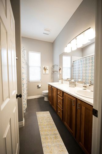 SAFAVIEH Evoke Collection Area Rug - 9' x 12', Gold & Ivory, Boho Oriental Design, Non-Shedding & Easy Care, Ideal for High Traffic Areas in Living Room, Bedroom (EVK224B) in Wooden and Grey Bathroom