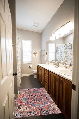 Artistic Weavers Reeta Printed Medallion Area Rug,4' Square,Bright Red/Wheat in Wooden and Grey Bathroom