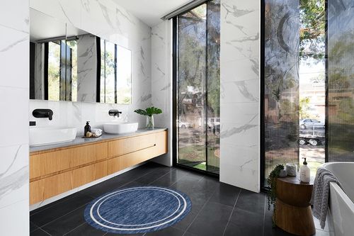 Nourison Essentials Indoor/Outdoor Solid Bordered Navy/Ivory 4' x Round Area Rug, Easy Cleaning, Non Shedding, Bed Room, Living Room, Dining Room, Backyard, Deck, Patio (4 Round) in Modern Black Tiled bathroom