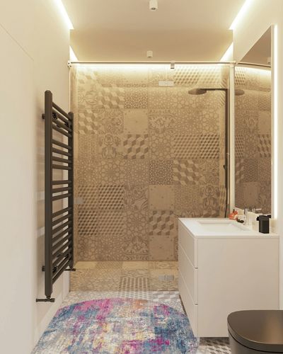 HomeRoots 4' Blue and Pink Round Abstract Power Loom Area Rug in White Tiled Bathroom