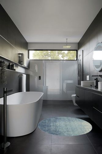 HomeRoots 4' Ivory and Blue Round Abstract Power Loom Area Rug in Black Modern Bathroom