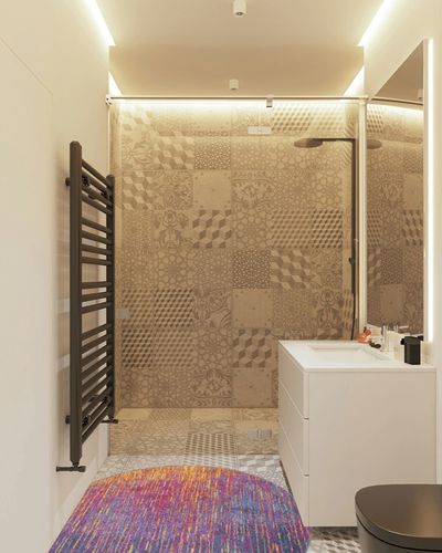 HomeRoots 4' Blue and Pink Round Abstract Power Loom Area Rug in White Tiled Bathroom