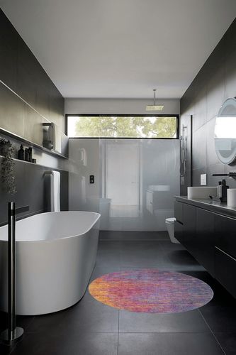 HomeRoots 4' Blue and Pink Round Abstract Power Loom Area Rug in Black Modern Bathroom