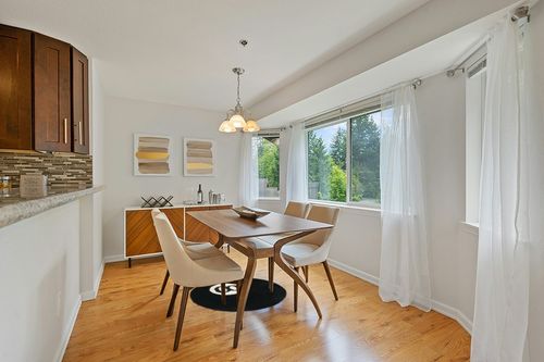 31 in Black White Round Area Rug, Soft Fluffy 8 Ball Billiard Non-Slip Living Room Bedroom Playroom Area Decor Rug (Black White, 31 in) in Modern White Dining Room with Wooden Accents