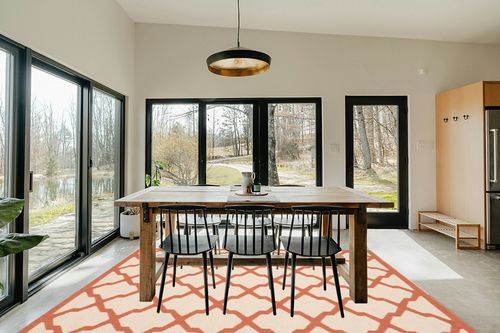 Safavieh Courtyard Beige & Terracotta 7'-10" x 7'-10" Square Indoor/Outdoor Rug in Scandinavian Dining Room with Rectangular Table