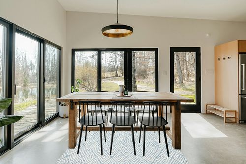 Safavieh Metro Collection Area Rug - 6' Round, Light Blue & Ivory, Handmade Wool, Ideal for High Traffic Areas in Living Room, Bedroom (MET455L) in Scandinavian Dining Room with Rectangular Table