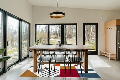 SAFAVIEH Hollywood Collection Area Rug - 5'3" x 7'6", Ivory & Peacock Blue, Mid-Century Modern Design, Non-Shedding & Easy Care, Ideal for High Traffic Areas in Living Room, Bedroom (HLW709B) in Scandinavian Dining Room with Rectangular Table