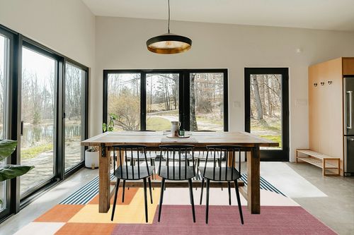 SAFAVIEH Orwell Collection Area Rug - 8' x 10', Rust & Yellow, Mid-Century Modern Abstract Design, Non-Shedding & Easy Care, Ideal for High Traffic Areas in Living Room, Bedroom (ORW368P) in Scandinavian Dining Room with Rectangular Table