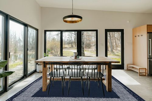 CAMILSON Navy Blue Area Rug 7'10" x 10', Easy-Cleaning Non-Shedding, Bordered for Living Room, Bedroom, Dining Room Navy Blue/Cream Indoor Area Rugs (8x10) in Scandinavian Dining Room with Rectangular Table