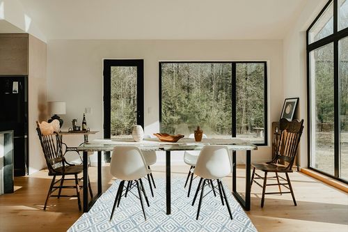 Safavieh Metro Collection Area Rug - 6' Round, Light Blue & Ivory, Handmade Wool, Ideal for High Traffic Areas in Living Room, Bedroom (MET455L) in Modern Scandinavian Dining Room with Black Accents