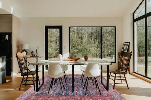 Safavieh Tucson Collection Area Rug - 8' Round, Rust & Blue, Traditional Persian Design, Non-Shedding Machine Washable & Slip Resistant Ideal for High Traffic Areas in Living Room, Bedroom (TSN153P) in Modern Scandinavian Dining Room with Black Accents