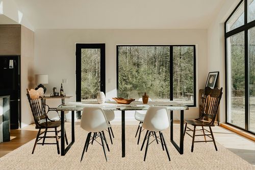 SAFAVIEH Natural Fiber Collection Area Rug - 9' x 12', Natural & Beige, Border Basketweave Seagrass Design, Easy Care, Ideal for High Traffic Areas in Living Room, Bedroom (NF114A) in Modern Scandinavian Dining Room with Black Accents