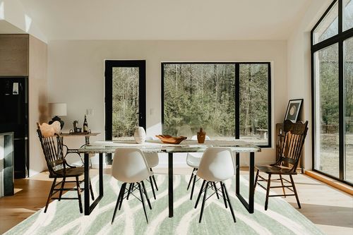 SAFAVIEH Adirondack Collection Area Rug - 8' x 10', Sage & Cream, Modern Wave Distressed Design, Non-Shedding & Easy Care, Ideal for High Traffic Areas in Living Room, Bedroom (ADR125X) in Modern Scandinavian Dining Room with Black Accents