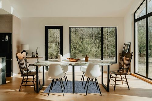 Nourison Practical Solutions Indoor/Outdoor Navy Blue 3' x 5' Area Rug, Easy Cleaning, Non Shedding, Bed Room, Living Room, Dining Room, Deck, Backyard, Patio (3x5) in Modern Scandinavian Dining Room with Black Accents