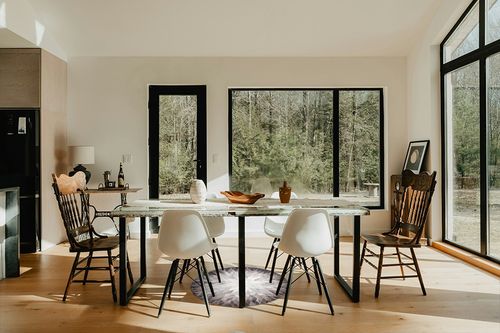 Real Cowhide Patchwork Rug 100% Handmade Cowhide Round Patchwork Rug Grey White Cow Hide Patchwork Floor Area Rug for Living Room Decor (4ft x 4ft) in Modern Scandinavian Dining Room with Black Accents