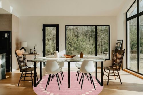 SAFAVIEH Kids Collection Area Rug - 7' Round, Pink, Handmade Wool, Polka Dot Border Design, Ideal for The Living Room, Bedroom, Dining Room, Kids Room, Nursery (SFK802U-7R) in Modern Scandinavian Dining Room with Black Accents
