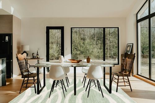 SAFAVIEH Adirondack Collection Area Rug - 6' x 9', Sage & Cream, Modern Wave Distressed Design, Non-Shedding & Easy Care, Ideal for High Traffic Areas in Living Room, Bedroom (ADR125X) in Modern Scandinavian Dining Room with Black Accents