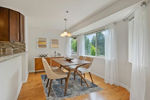 Washable Rug 5x7 Area Rugs for Bedroom, Soft Low Pile Living Room Rugs with Non-Slip Backing, Vintage Patchwork Indoor Floor Carpet for Dining Room Nursery Home Office-Blue/Grey in Modern White Dining Room with Wooden Accents