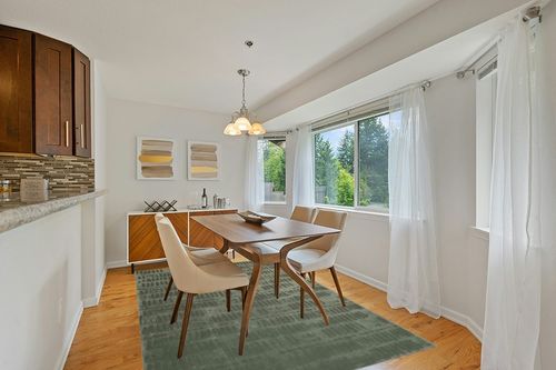 Revival Rugs Shell 6'7"x9' Machine Washable Area Rug for Living Room Bedroom - 100% Recycled Oeko-TEX Certified, Medium Pile, Green in Modern White Dining Room with Wooden Accents