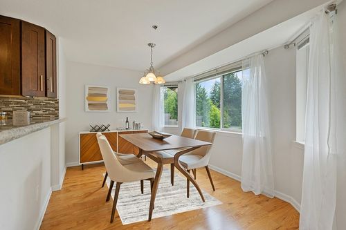 Nourison Glam Abstract Cream Grey 3'11" x 5'11" Area Rug, Easy Cleaning, Non Shedding, Bed Room, Living Room, Dining Room, Backyard, Deck, Patio (4x6) in Modern White Dining Room with Wooden Accents