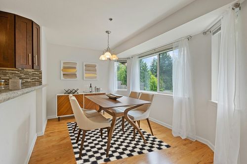 Balta Rugs Oslo Checkered Shag Rug, Black, 5' 3" x 7' in Modern White Dining Room with Wooden Accents