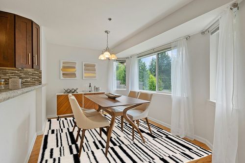 Hauteloom Deren Living Room, Bedroom Bohemian Shag Area Rug - Soft Shaggy Farmhouse - High Plush Pile - Black, White, Cream, Light Beige, Ivory - 7'10" x 10' in Modern White Dining Room with Wooden Accents