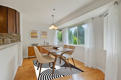 Minimalist Modern Black and White Area Rug 5x7 Mid-Century Arch Art Deco Rugs for Living Room Dining Room Bedroom Soft Thick Faux Wool Home Office Playroom Kitchen Carpet in Modern White Dining Room with Wooden Accents