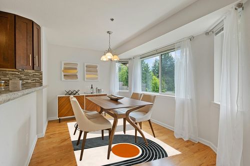 Mid-Century Modern Minimalist Circles and Lines Pattern Soft Wool Area Rug 6x9 Washable Boho Carpet for Living Room Bedroom No-Slip Thick Dining Room Rug Indoor Floorcover Mat in Modern White Dining Room with Wooden Accents