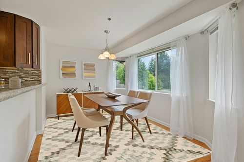 Dash & Albert Diamond Cove Hand Tufted Wool Rug, 8 X 10 Feet, Green/Sky Blue Geometric Pattern in Modern White Dining Room with Wooden Accents