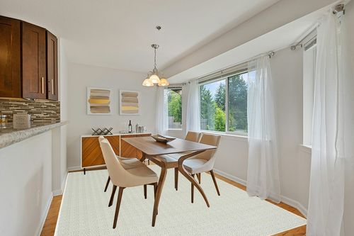 Safavieh Hampton Collection Area Rug - 8' x 10', Green, Non-Shedding & Easy Care, Indoor/Outdoor & Washable-Ideal for Patio, Backyard, Mudroom (HTN230Y) in Modern White Dining Room with Wooden Accents