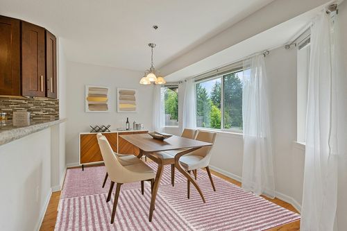 Safavieh Natura Collection Area Rug - 8' x 10', Ivory & Red, Handmade Modern Geometric Wool, Ideal for High Traffic Areas in Living Room, Bedroom (NAT227Q) in Modern White Dining Room with Wooden Accents