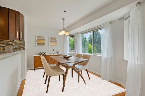 Safavieh Kilim Collection Area Rug - 8' x 10', Natural & Ivory, Handmade Rustic Boho Diamond, Ideal for High Traffic Areas in Living Room, Bedroom (KLM449A) in Modern White Dining Room with Wooden Accents
