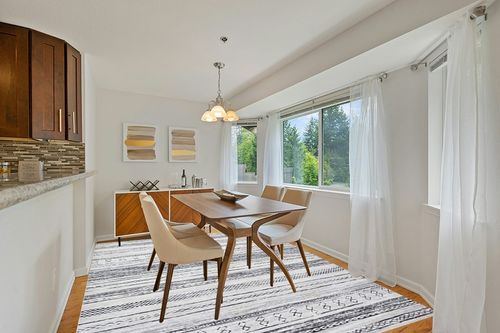8x10 Washable Large Soft Neutral Boho Moroccan Bohemian Farmhouse Rug in Modern White Dining Room with Wooden Accents