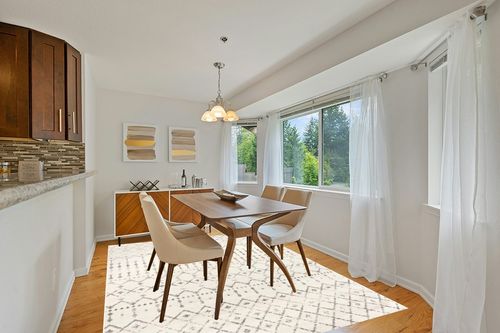nuLOOM Moroccan Blythe Area Rug, 6' 7" x 9', Grey/Off-white in Modern White Dining Room with Wooden Accents