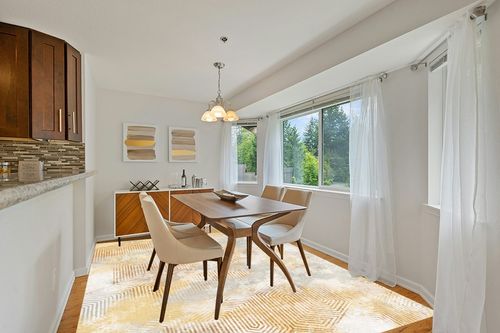 Art&Tuft Washable Rug in Modern White Dining Room with Wooden Accents