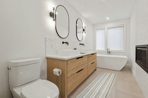 Garland Rug Carnival Stripe 2 Ft. x 8 Ft. Earth Tone Runner Rug in Scandinavian Neutral bathroom